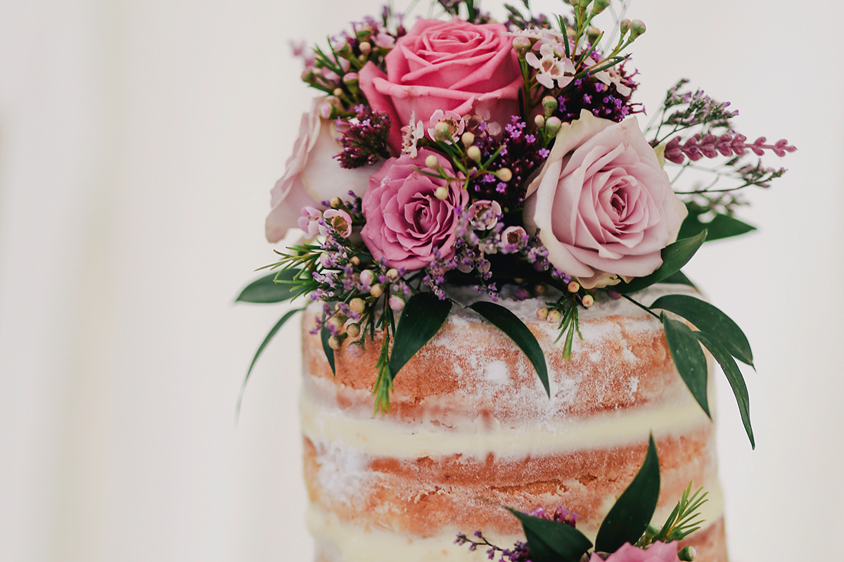 CELEBRATION CAKE$120 - Our chef can create a stunning semi-naked style celebration cake adorned with fresh flowers in the flavours of your choice, served on a beautifully decorated cake table complemented by vintage tea ware to match your theme.